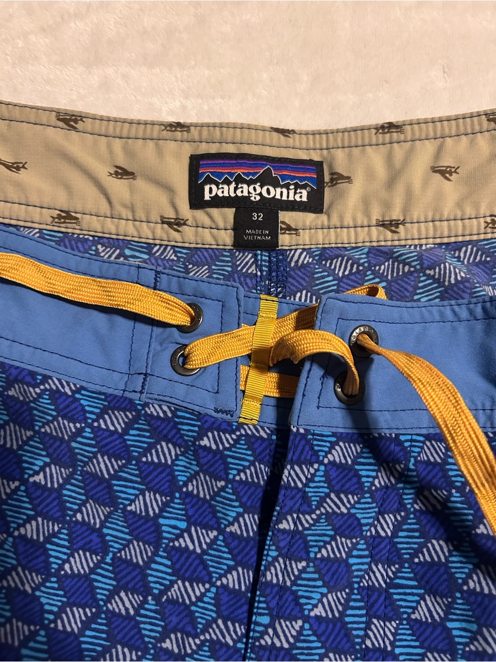 Patagonia Men’s Blue Geometric Swim Board Shorts with Yellow Drawstring